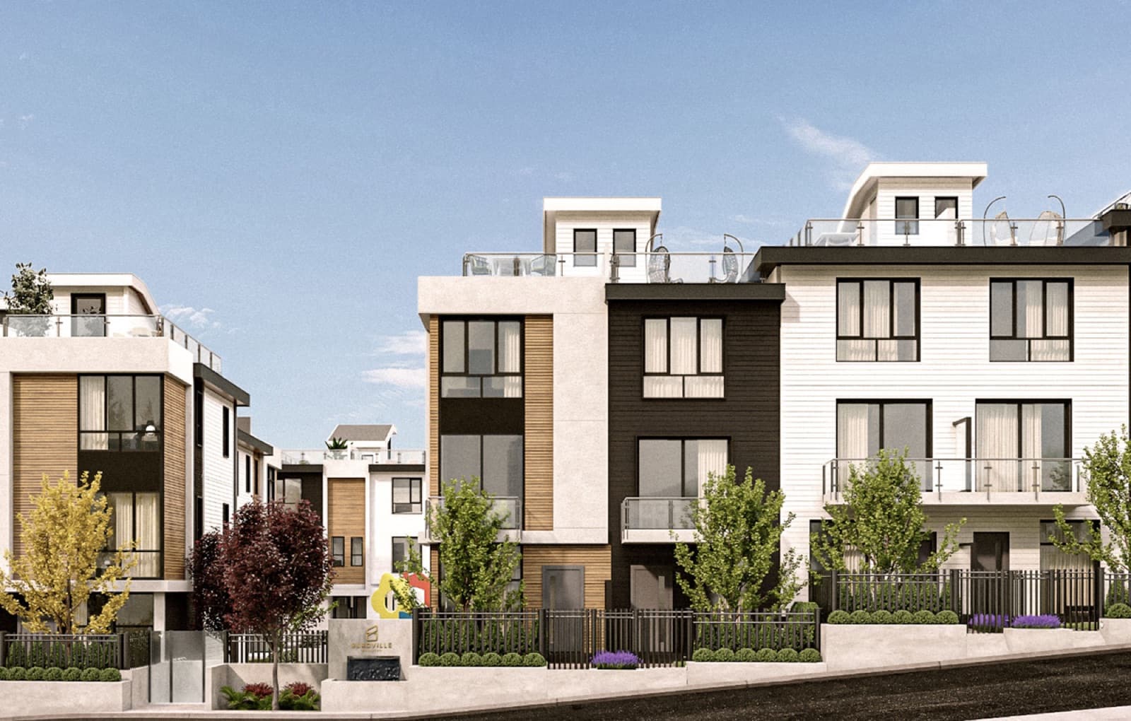 Burqville – Street-level view of modern three-story townhomes with white, black, and wood-toned facades, glass balcony railings, landscaped fencing, and a Burqville development sign.