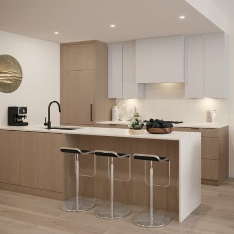 Burqville – A kitchen with light wood lower cabinets, white upper cabinets and range hood, a waterfall-edge island with black bar stools, and a built-in espresso machine.