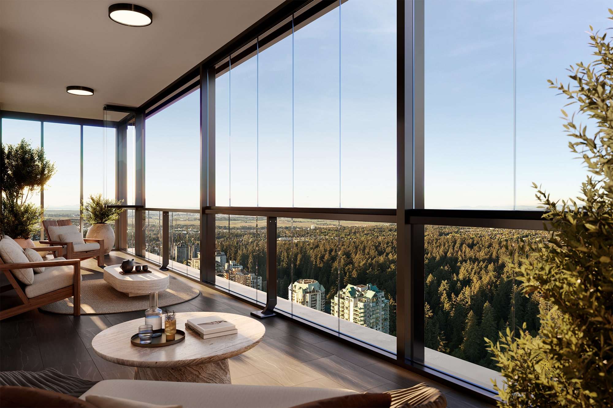 Solhouse 6035 – A modern enclosed glass balcony set up as a sunroom living space with sleek low-profile armchairs, stone coffee tables, and potted greenery. Floor-to-ceiling glass panels offer an expansive high-angle view over a dense green forest, distant residential towers, and a clear blue sky during late afternoon daylight.
