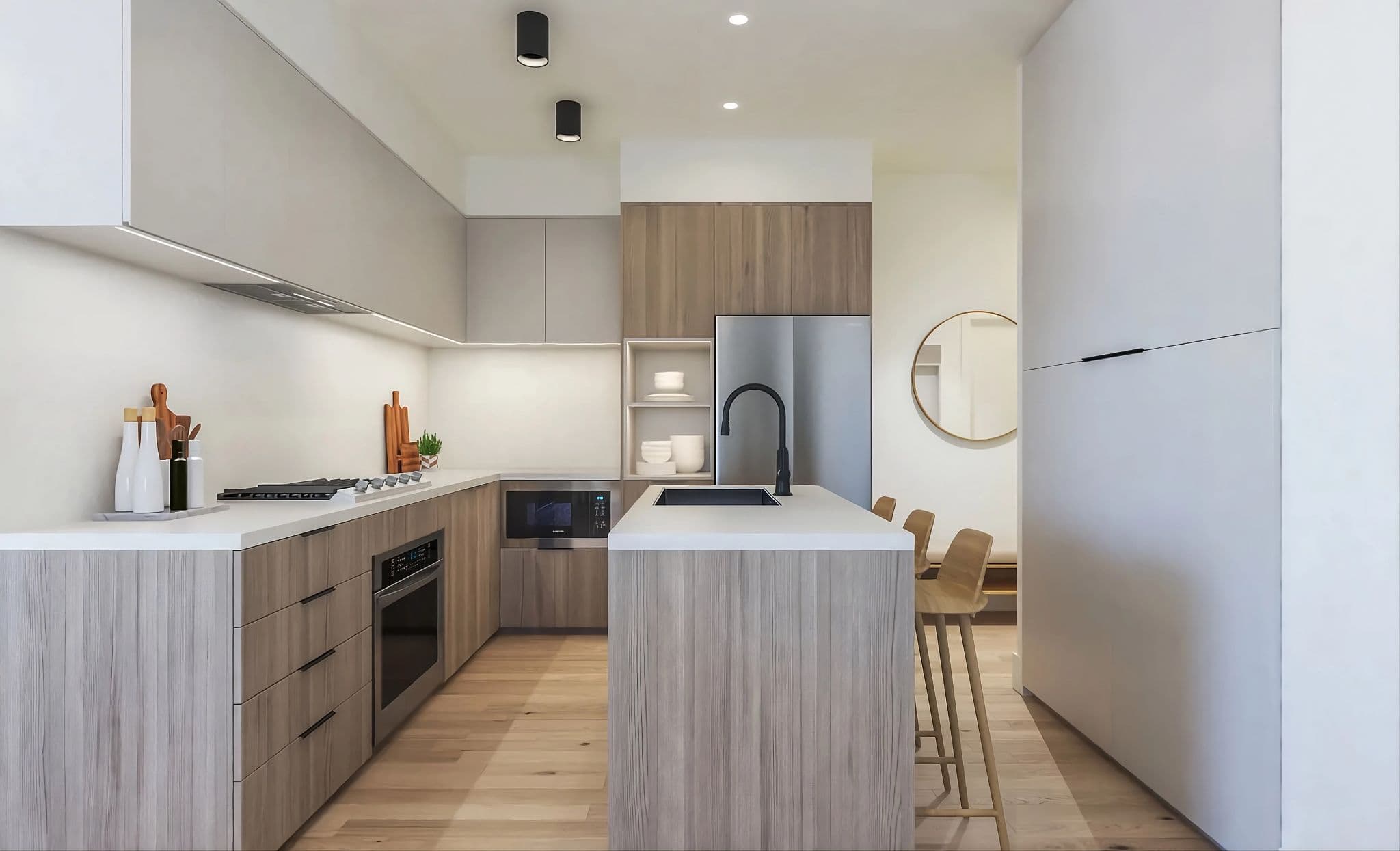 Aavand – A modern, minimalist kitchen features a central island with wood-grain laminate panels, a white countertop, and a sleek black gooseneck faucet with an integrated sink. Surrounding L-shaped cabinetry pairs flat-panel upper cupboards with light wood lower cabinets, stainless steel appliances, under-cabinet lighting, and light hardwood floors.