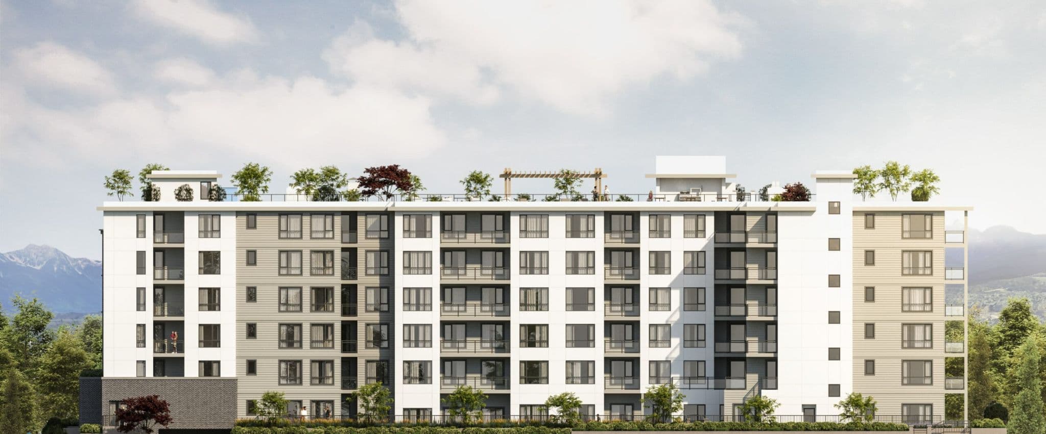 La Riviere – A front elevation view of a mid-rise apartment building with white, beige, and grey siding panels, balconies, and a rooftop terrace with pergola.