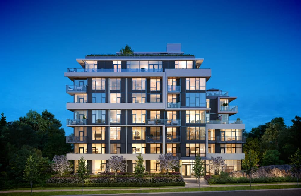 Slate & Ash – Night-time exterior of the building fully lit up against a deep blue sky, showing the rooftop terrace and multiple balcony levels.