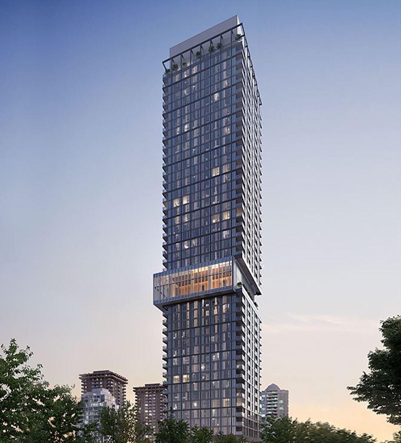 Central Park House – A high-rise residential skyscraper featuring dark glass facade panels and stacked balconies rises tall against a clear twilight sky. The tower's architectural design features a cantilevered multi-story glass section midway up, framed by surrounding tree canopy tops at street level.