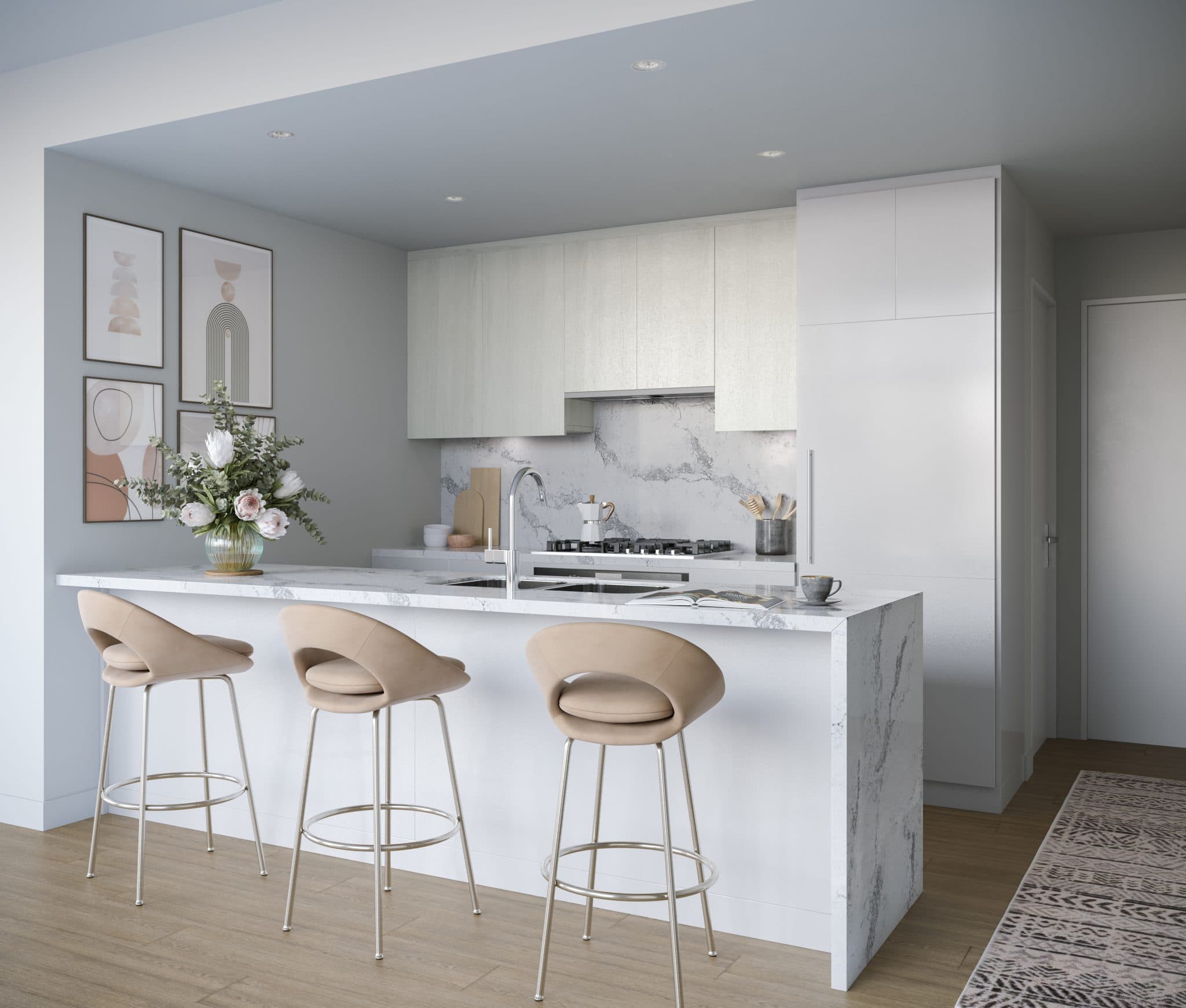 Vue – A bright, modern kitchen featuring a marble waterfall island with three contemporary beige barstools and light wood-tone cabinetry. The space is styled with abstract framed art on light gray walls, a gas stovetop with a matching marble backsplash, and a floral centerpiece.