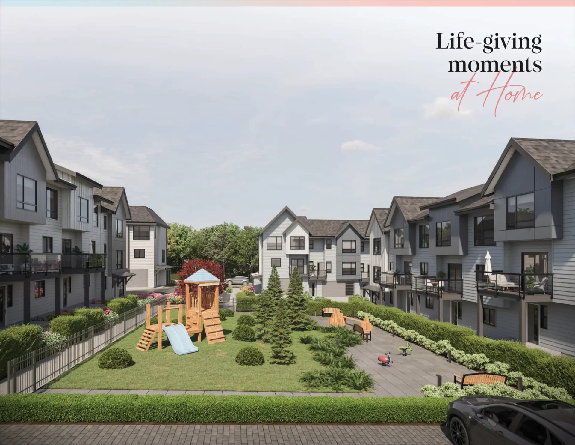 Gradience – A bright daytime architectural rendering of a shared outdoor courtyard and children's play area framed by modern multi-story townhomes. The central green space features a wooden play structure with a slide, landscaped lawn with small trees, paved seating areas with benches, and manicured hedges.
