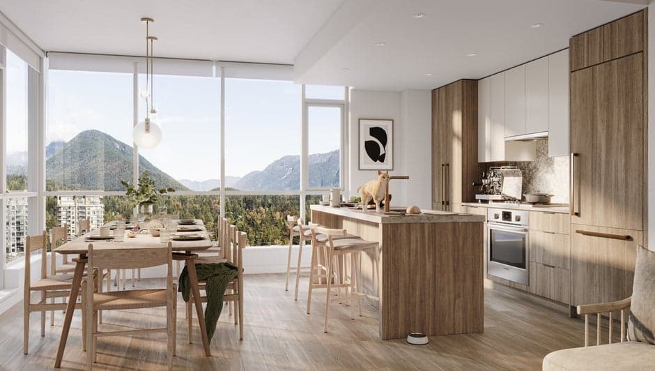 Parkside at Lynn – Open-concept kitchen and dining area with a wood island, a small cat on the counter, and floor-to-ceiling windows showing a mountain view.