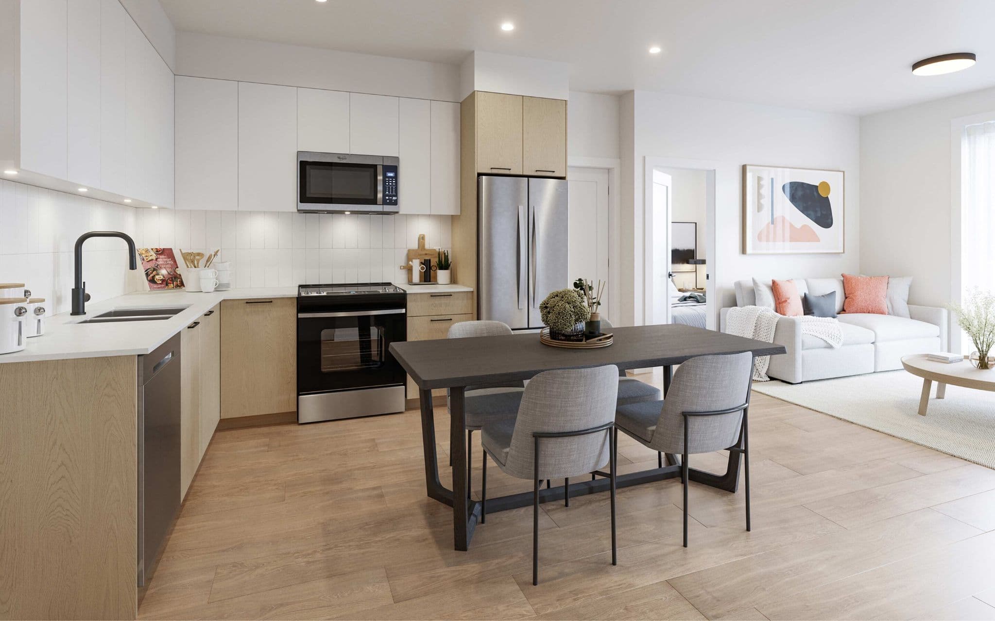 City and Laurel – An open-concept kitchen and dining area features light wood lower cabinets, white upper cabinets, stainless steel appliances, and a dark wood dining table with gray upholstered chairs. The bright, naturally lit space connects smoothly to an adjoining living room with a white sofa, warm accent pillows, and an abstract art piece on the wall.