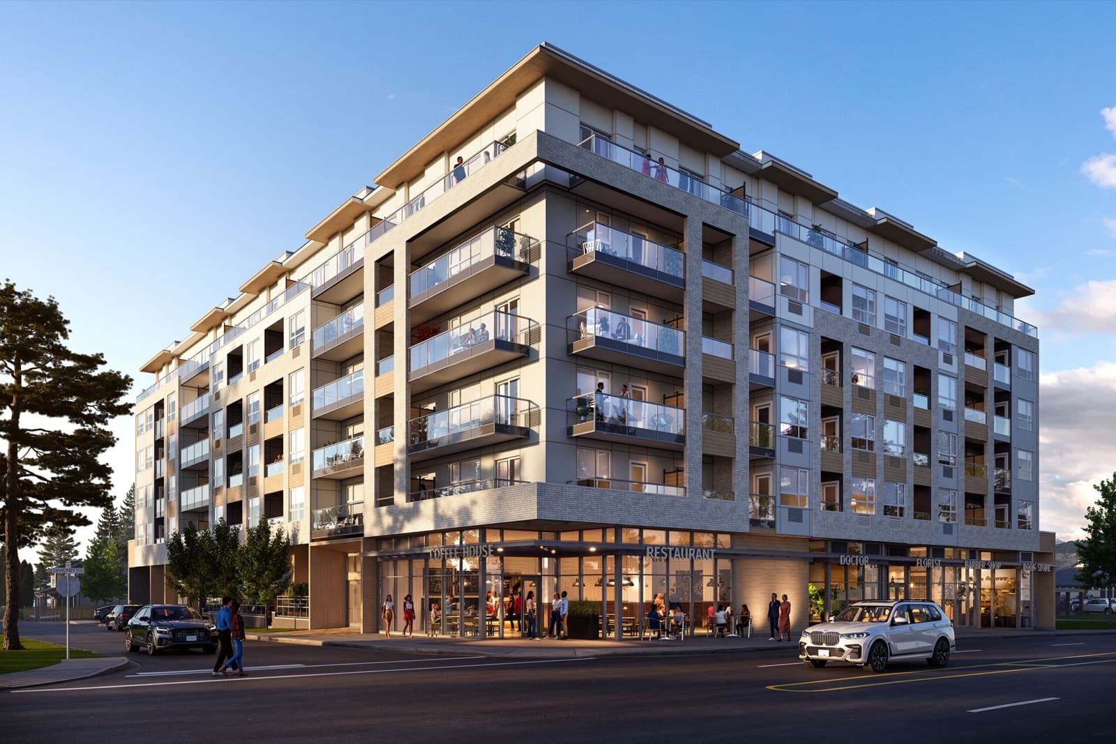 City and Laurel – Twilight street-level rendering of a mid-rise mixed-use building with balconies above and ground-floor retail including a coffee house, restaurant, doctor, florist, and barber shop, with pedestrians and cars outside.