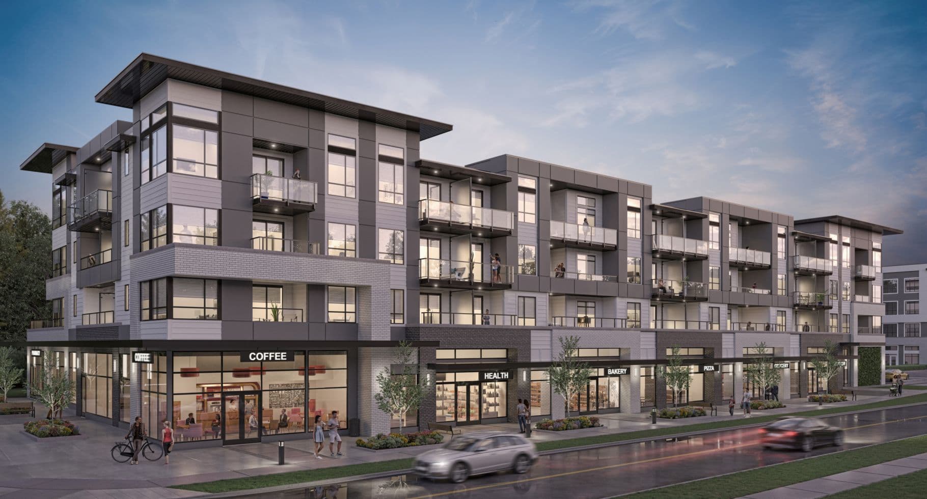 Amson Bloc – An architectural rendering of a multi-story mixed-use building at dusk, featuring ground-floor retail shops such as a coffee shop and bakery beneath several floors of modern gray-and-white residential apartments with glass balconies. Pedestrians stroll along the landscaped sidewalk in front, while blurred cars move along the damp street under a softly lit evening sky.