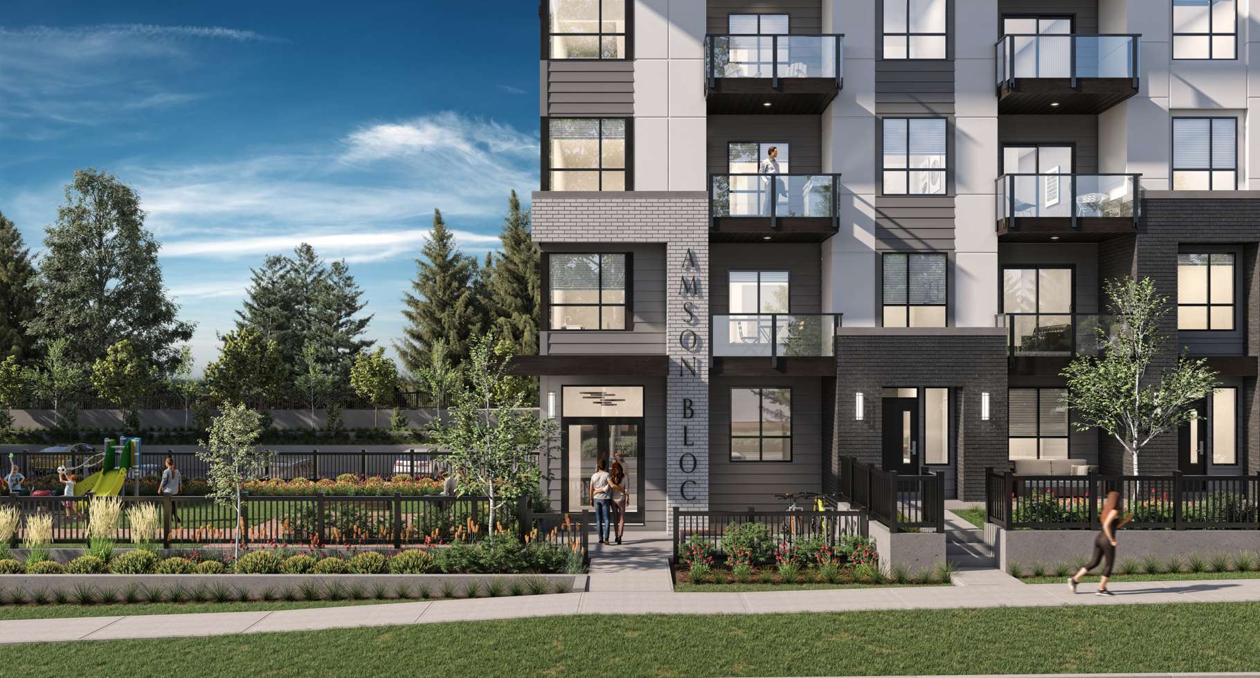 Amson Bloc – A ground-level rendering of a modern mid-rise residential building featuring grey and white horizontal siding, dark brick accents, and glass balconies. The foreground shows landscaped pathways, fenced patio areas, a sidewalk with pedestrians, and an adjacent community playground under a bright blue sky.