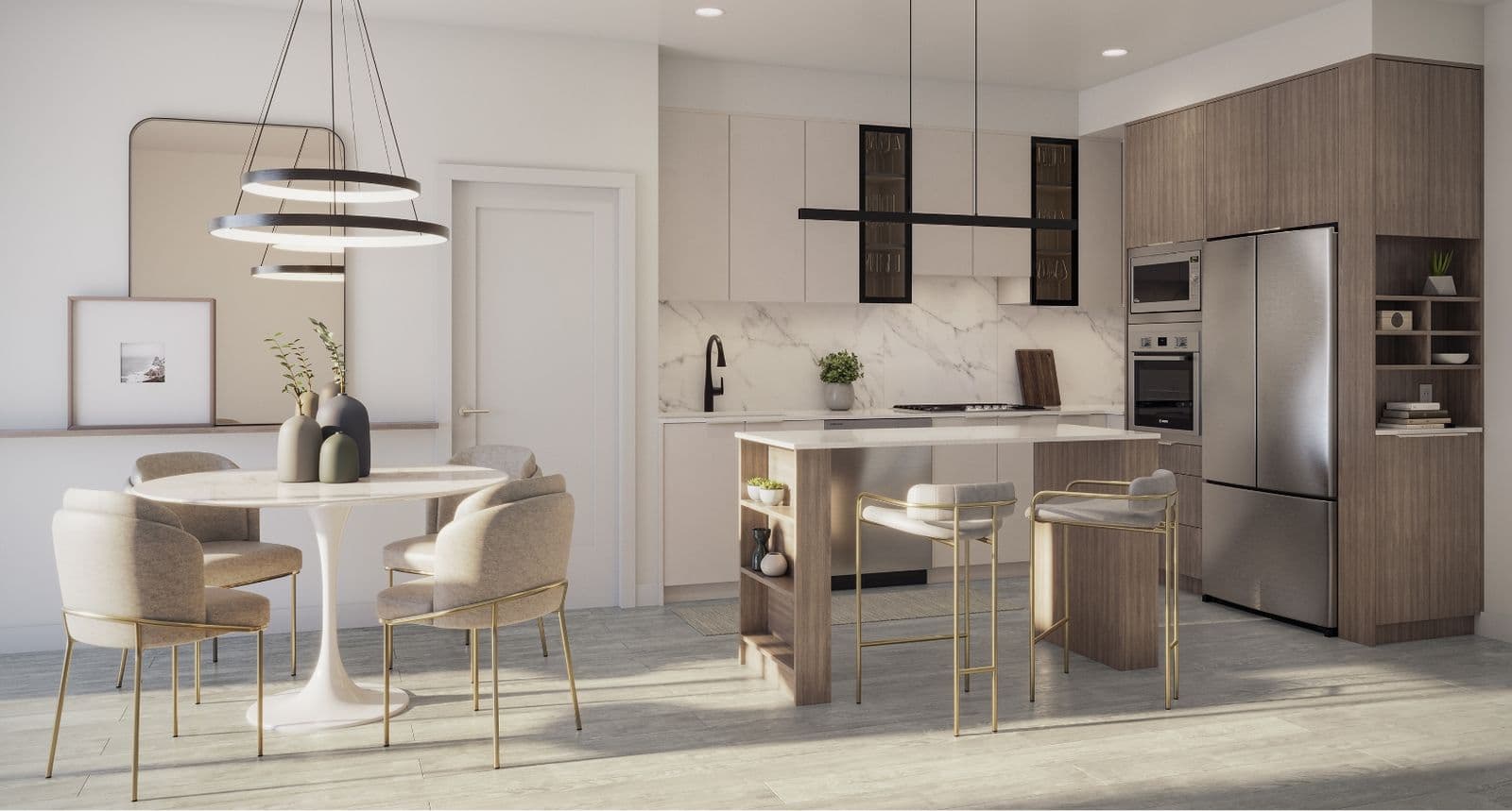 Amson Bloc – Open-concept kitchen and dining room with marble backsplash, wood cabinetry, a round dining table with cream chairs, and a kitchen island with bar stools.