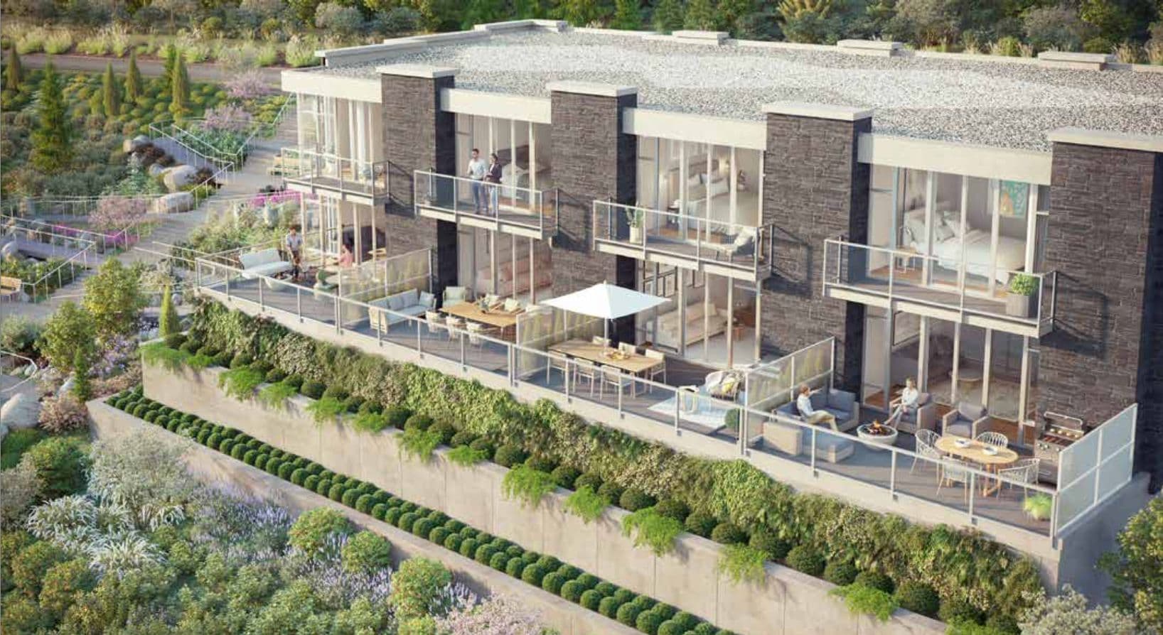 Evelyn – Aerial view of a terraced building with private balcony patios featuring outdoor furniture and greenery.