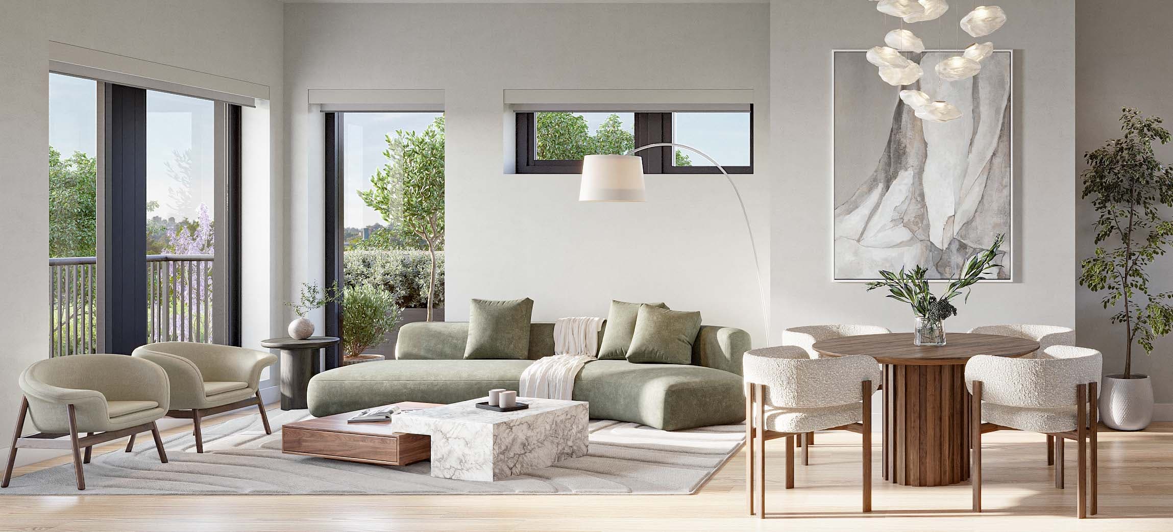 Nolia – A bright, open-plan living and dining space featuring a curved sage green sofa, a marble and wood coffee table, and a round wooden dining table with textured chairs. Large windows and glass doors let in ample daylight and reveal lush outdoor greenery and a balcony area.