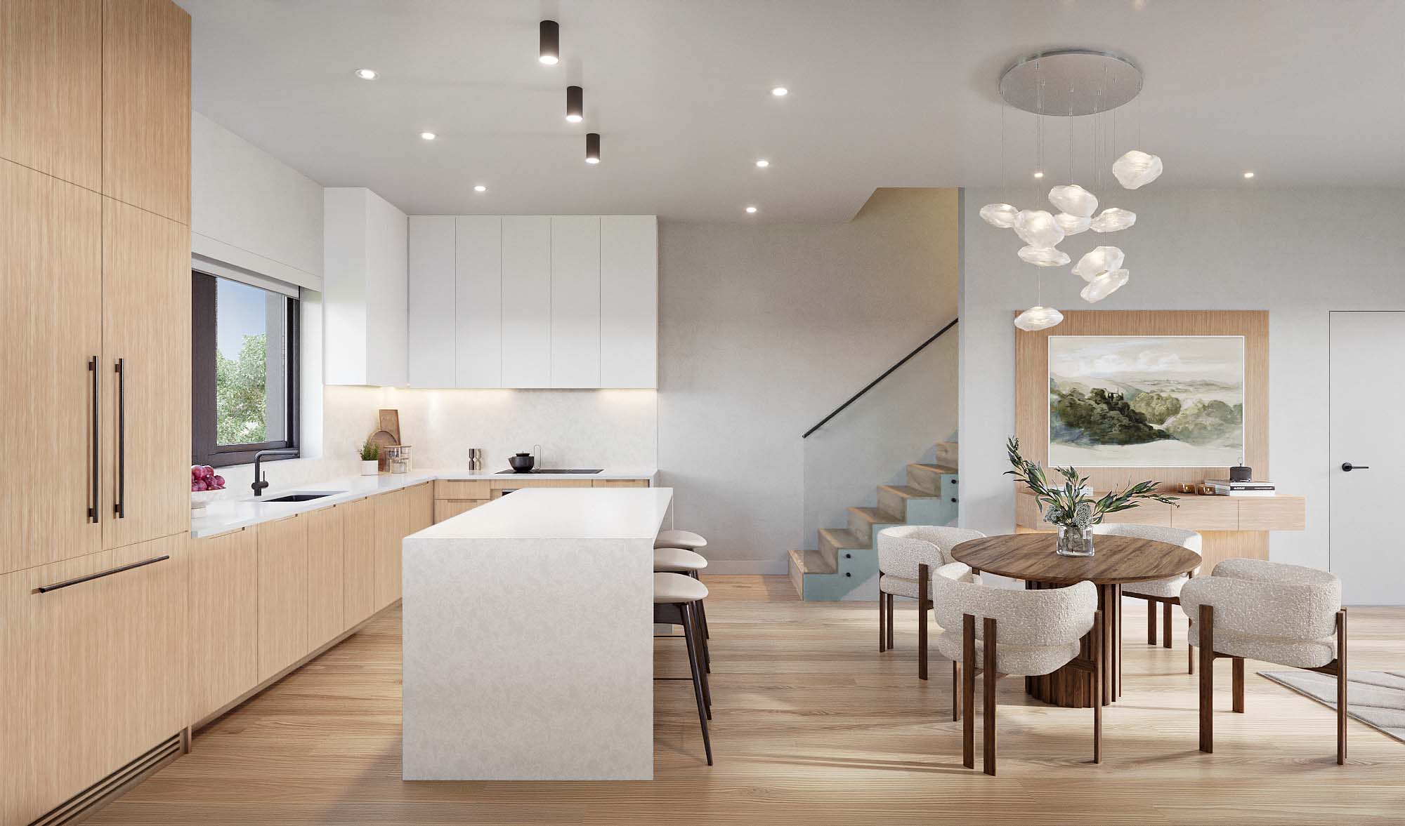 Nolia – A bright, open-concept kitchen and dining area features light wood cabinetry, a white waterfall island, and hardwood floors. Adjacent to an open staircase, a round wooden dining table is surrounded by four plush textured chairs beneath a modern cloud-like pendant light.
