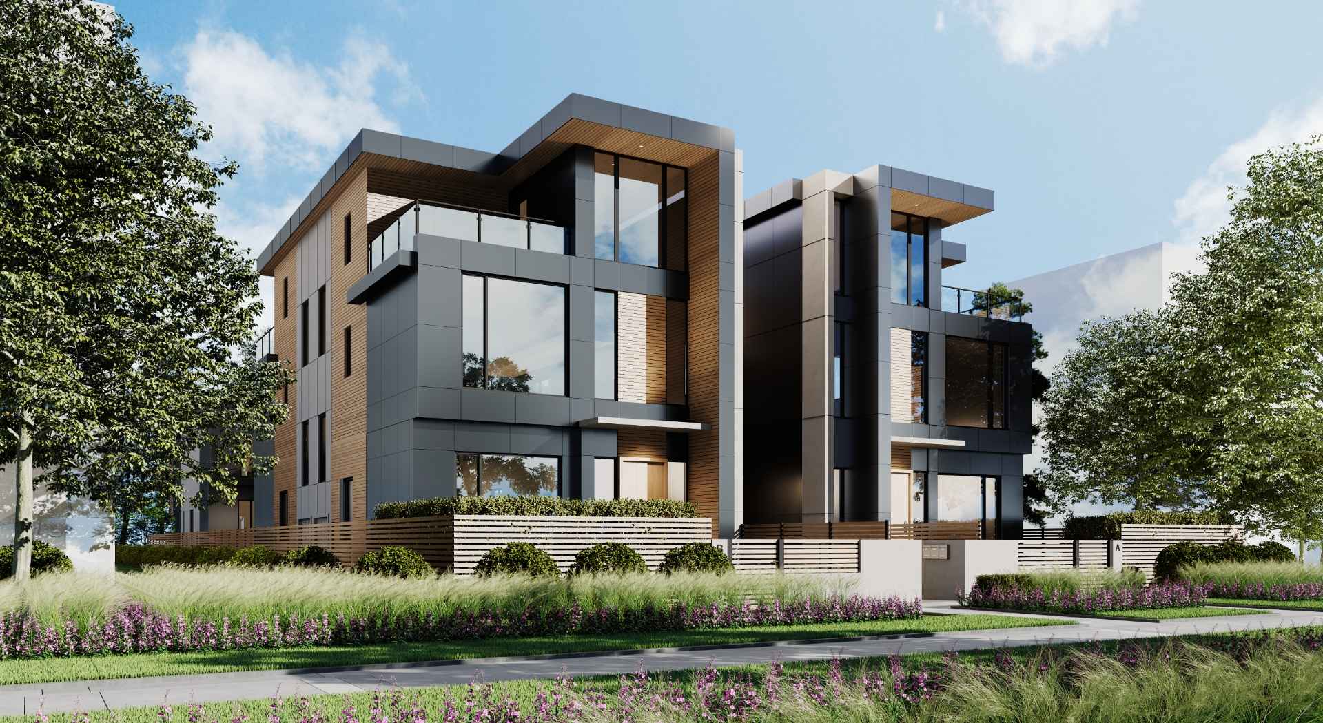 AderaWest – A sunny street-level view of two modern, multi-story residential buildings featuring charcoal gray paneling, warm wood siding, and large floor-to-ceiling windows. The front is landscaped with low wooden slatted fences, manicured hedges, purple flowers, and tall ornamental grasses along the sidewalk.