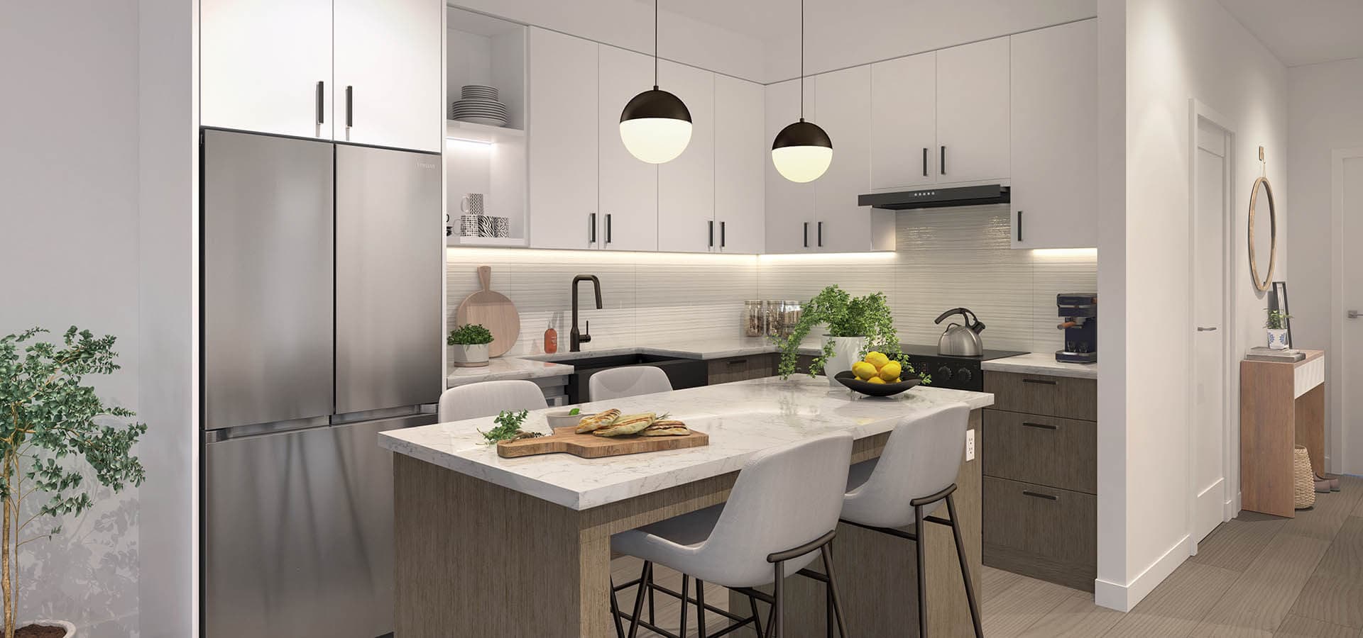 Guilden – A kitchen with white cabinetry, two black globe pendant lights, a stainless steel french-door refrigerator, marble-look countertops, and a large island with bar seating and food staged on a cutting board.