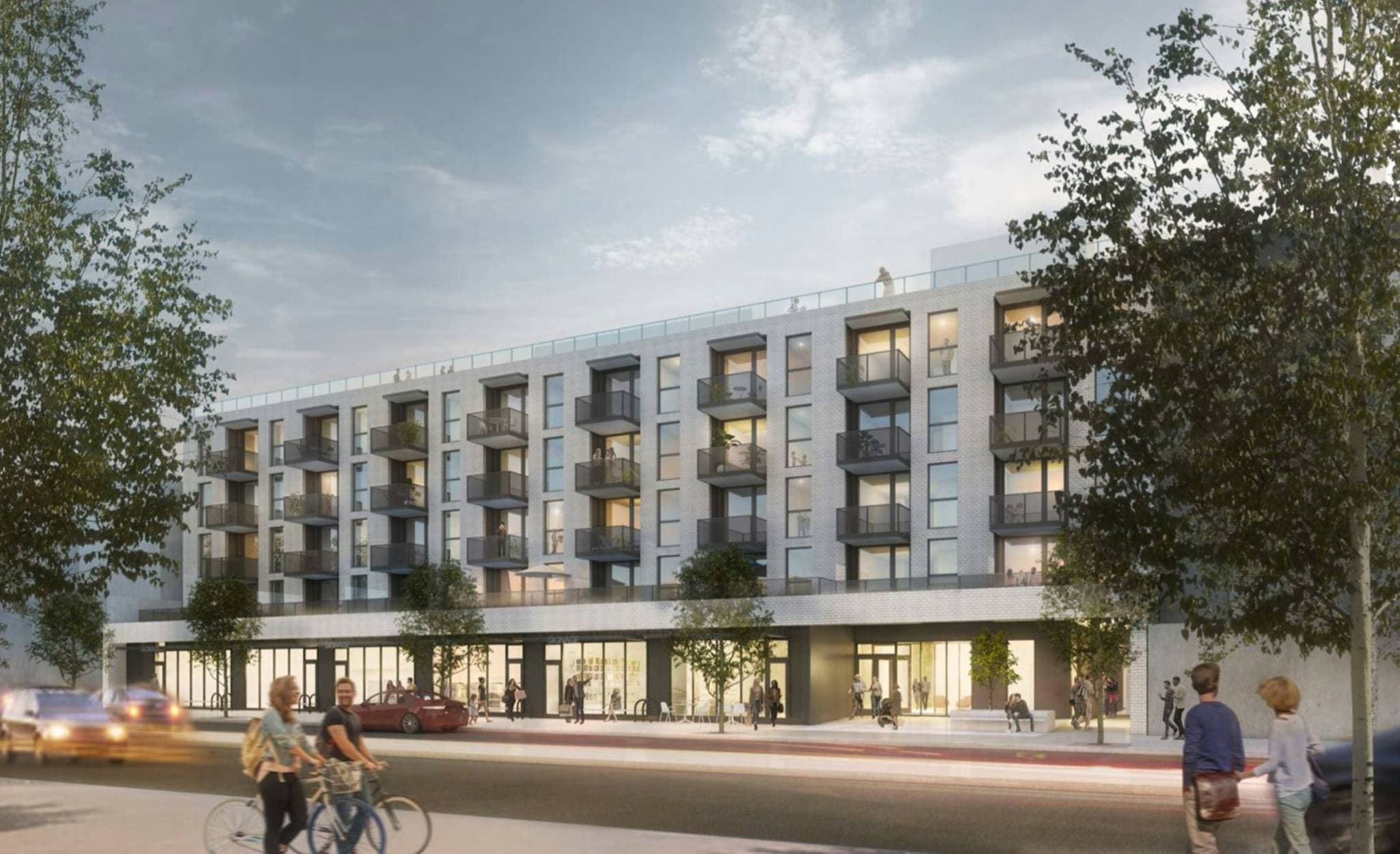 141-155 West 3rd Street – A street-level exterior view of a modern five-story mid-rise building featuring a light grey brick facade, dark metal balconies, and ground-floor retail spaces. Pedestrians, cyclists, and cars line the foreground street under a soft, overcast sky.