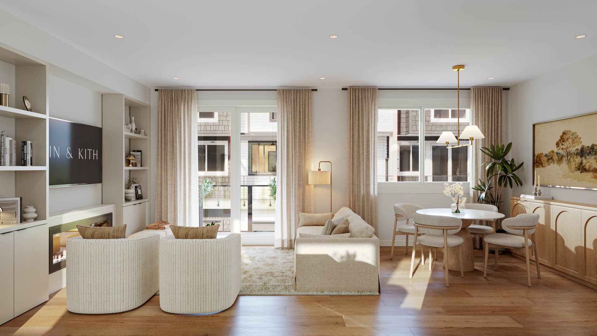 Kin & Kith – An open-concept living and dining space with built-in shelving surrounding an electric fireplace, comfortable armchairs, sofa, and a dining table setup.