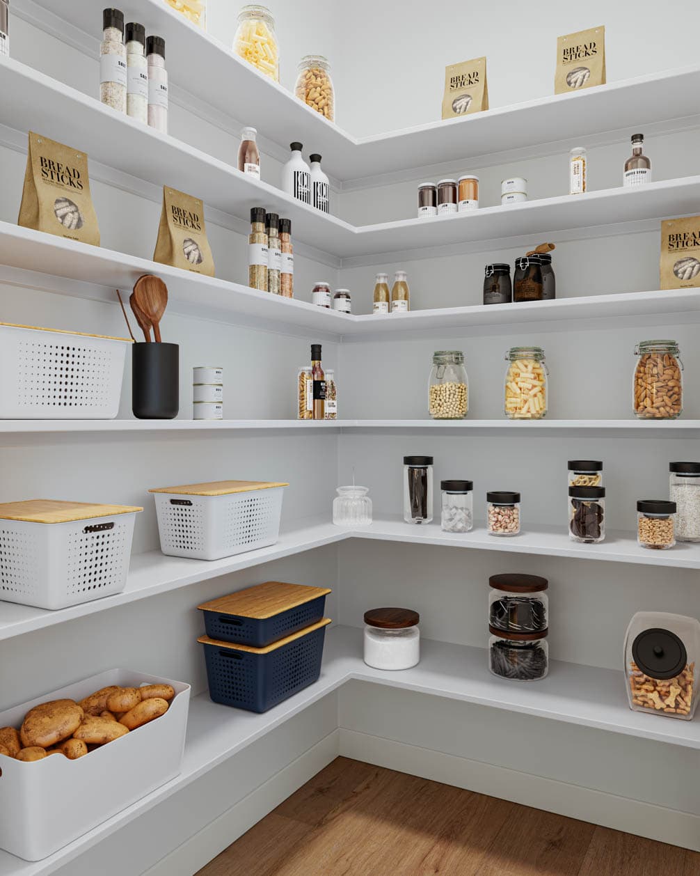 Kin & Kith – A walk-in pantry with wrap-around white shelving storing glass jars, dry goods, and storage bins.