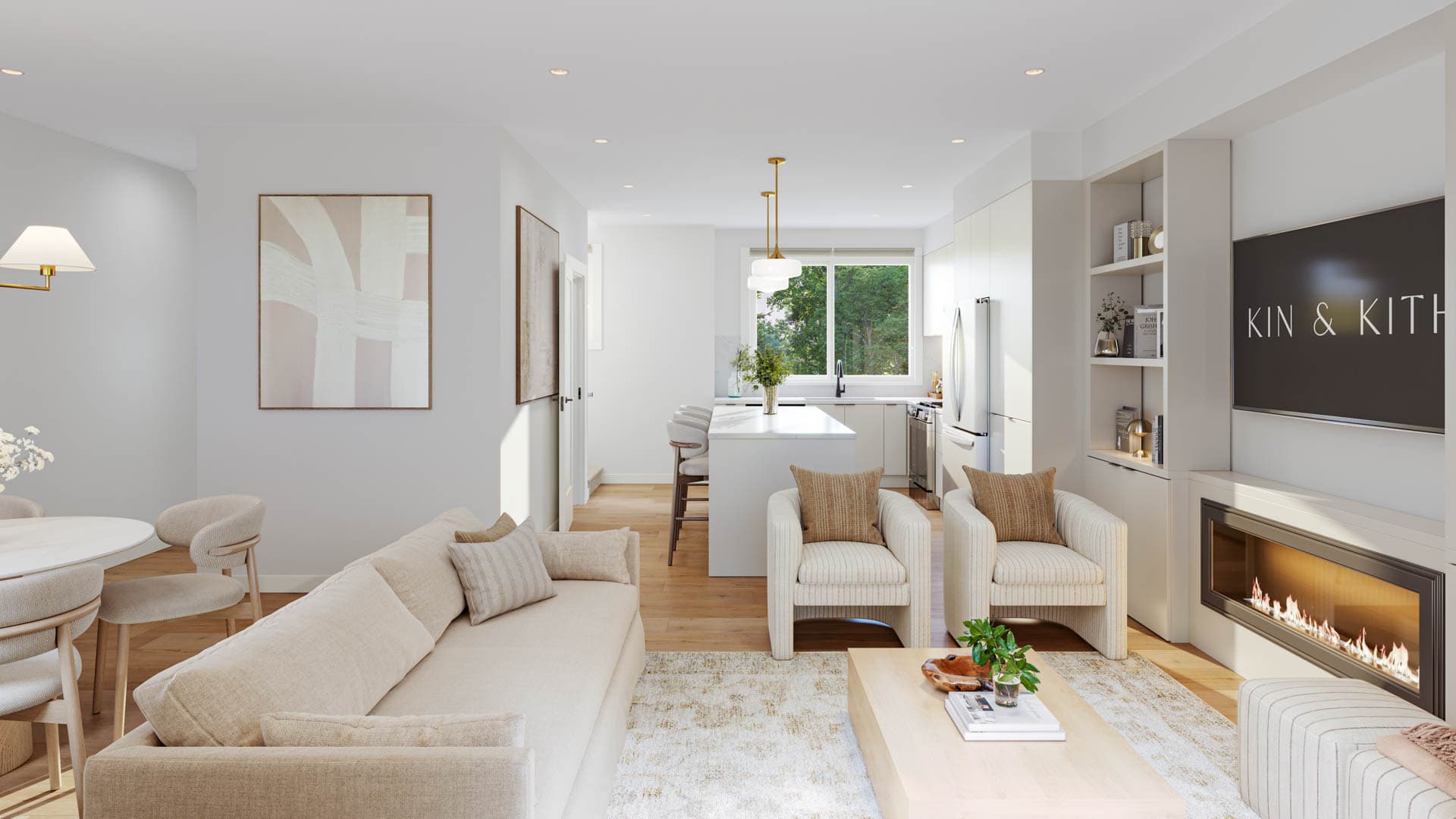 Kin & Kith – Broad view of an open-concept main floor connecting the living area with modern linear fireplace to the dining set and kitchen in the background.