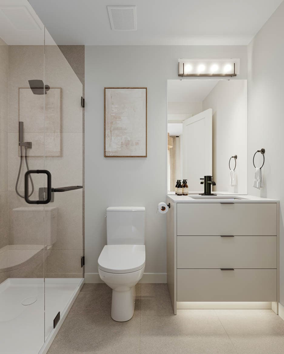 Kin & Kith – Ensuite bathroom with light grey floating vanity cabinet, undermount lighting, frameless walk-in shower, toilet, and black fixtures.
