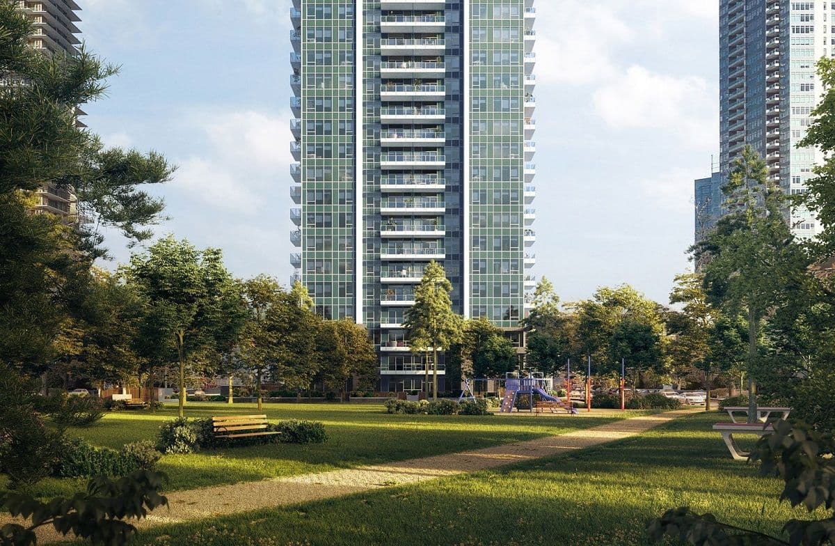 Maywood on the Park – High-rise tower seen from a park with a children's playground and picnic tables in the foreground.