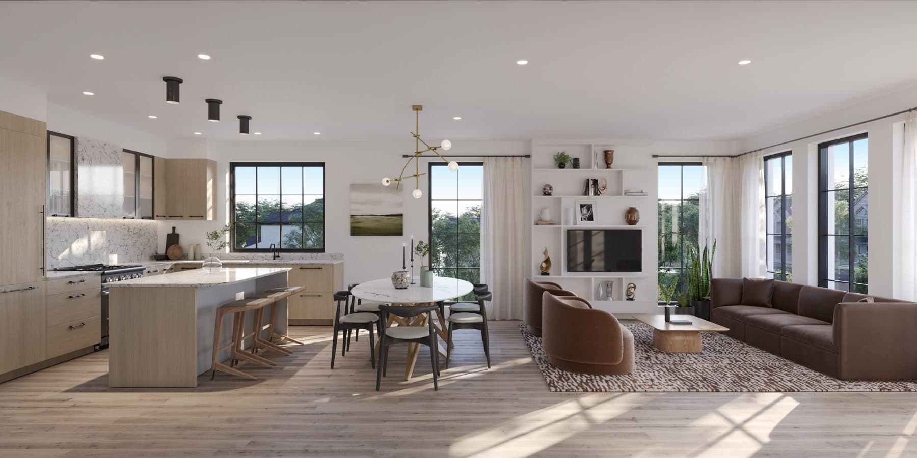 King and Columbia – A bright, open-concept living area seamlessly connects a modern kitchen, an oval dining set, and a cozy living space anchored by a brown sofa and plush armchairs. Large black-framed windows flood the light wood floors with natural sunlight while offering views of lush green trees outside.