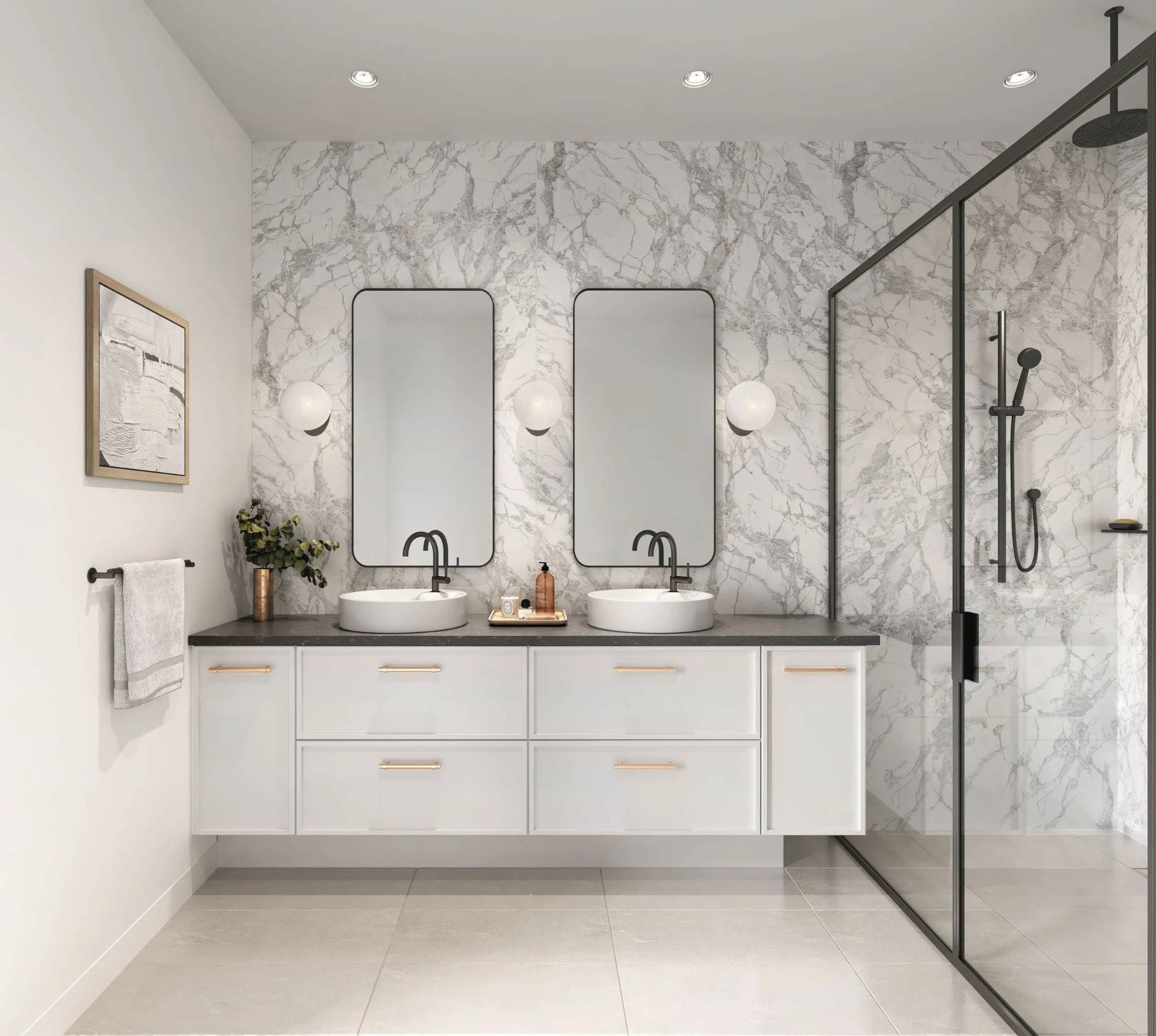 King and Columbia – A modern bathroom featuring a double floating vanity with white cabinets, gold hardware, dual vessel sinks, and black fixtures set against a white marble accent wall. A glass-enclosed walk-in shower with matte black fixtures sits adjacent to the vanity, complementing the sleek round wall sconces and minimalist mirrors.