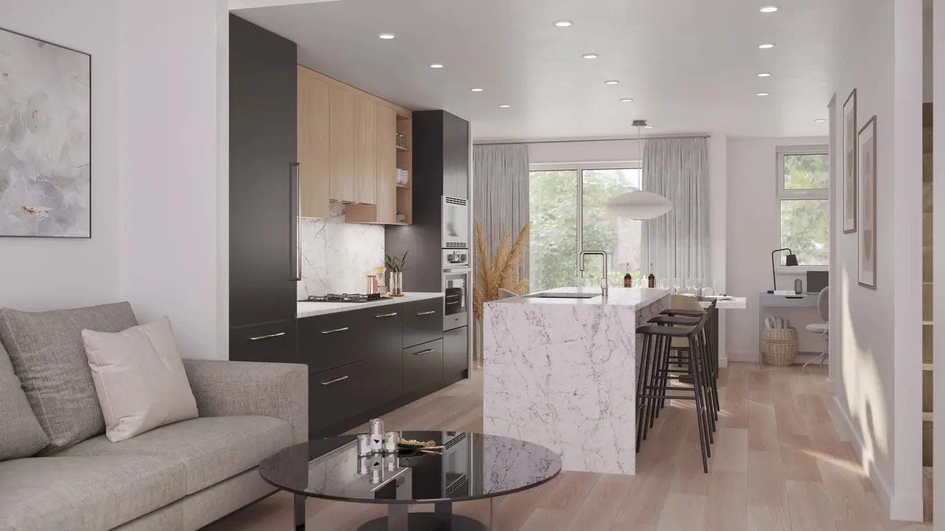 Emerald – Open-concept living room and kitchen rendering with a grey sofa, dark cabinetry with light wood upper cabinets, marble island with black barstools, and a dining nook by a window.