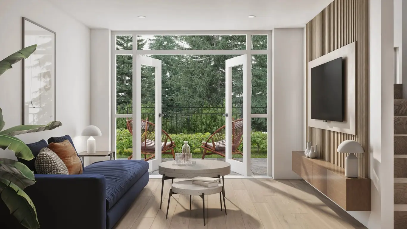 Emerald – Living room rendering with a navy blue sofa, wood slat TV feature wall, and French doors opening onto a patio with woven chairs and greenery.
