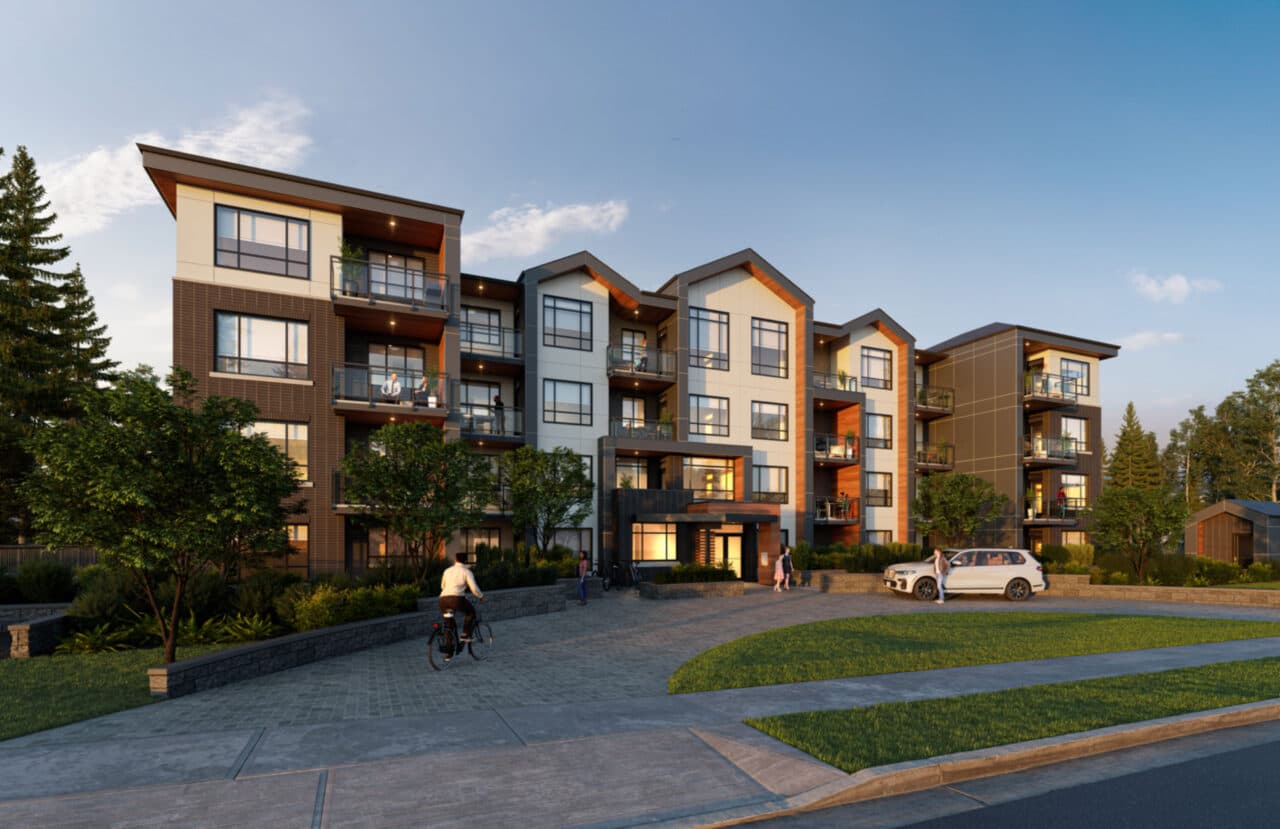 Preston on Fourteenth – Street-level view of a modern condo building facade at dusk with balconies, a cyclist, and a paved entrance courtyard.