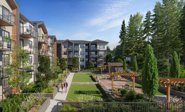 Preston on Fourteenth – Shared outdoor courtyard between building wings with a wooden pergola, playground equipment, lawn, and walking path.