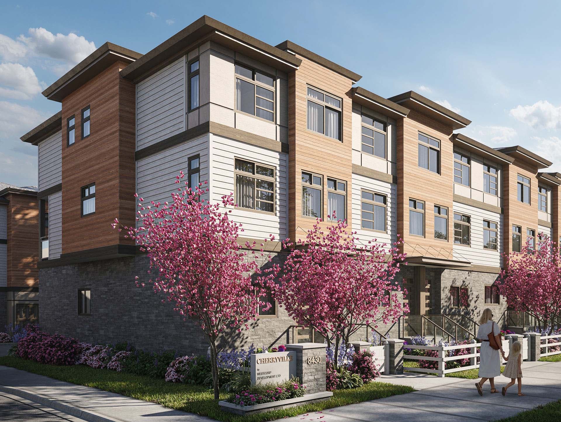 Cherryville – Corner view of a modern townhome building with mixed wood and stone siding, a flowering cherry tree out front, and a Cherryville by Westcorp Development sign.