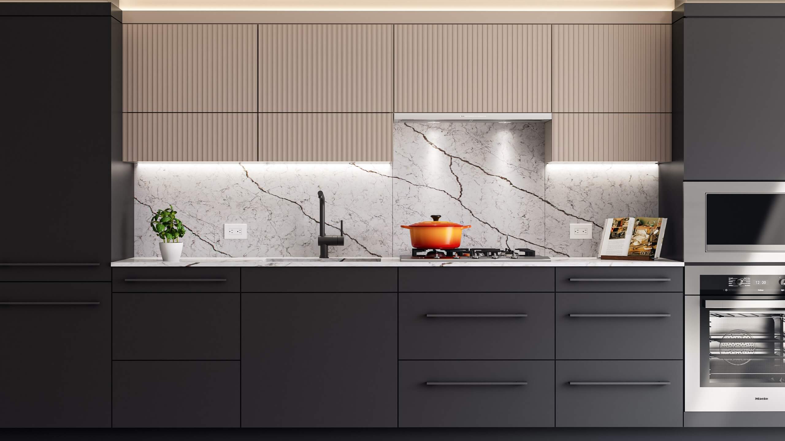 Concord Metrotown – A modern kitchen featuring matte charcoal lower cabinetry, fluted beige upper cabinets, and a white marble backsplash with dramatic dark veining. Under-cabinet lighting illuminates a gas cooktop with an orange Dutch oven, a black matte faucet, a small potted plant, and a built-in stainless steel Miele wall oven.