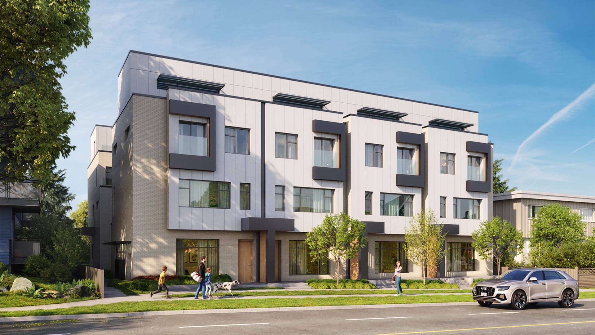 Terza – Street-level daytime view of the modern townhome building with people and a dog walking past on the sidewalk.