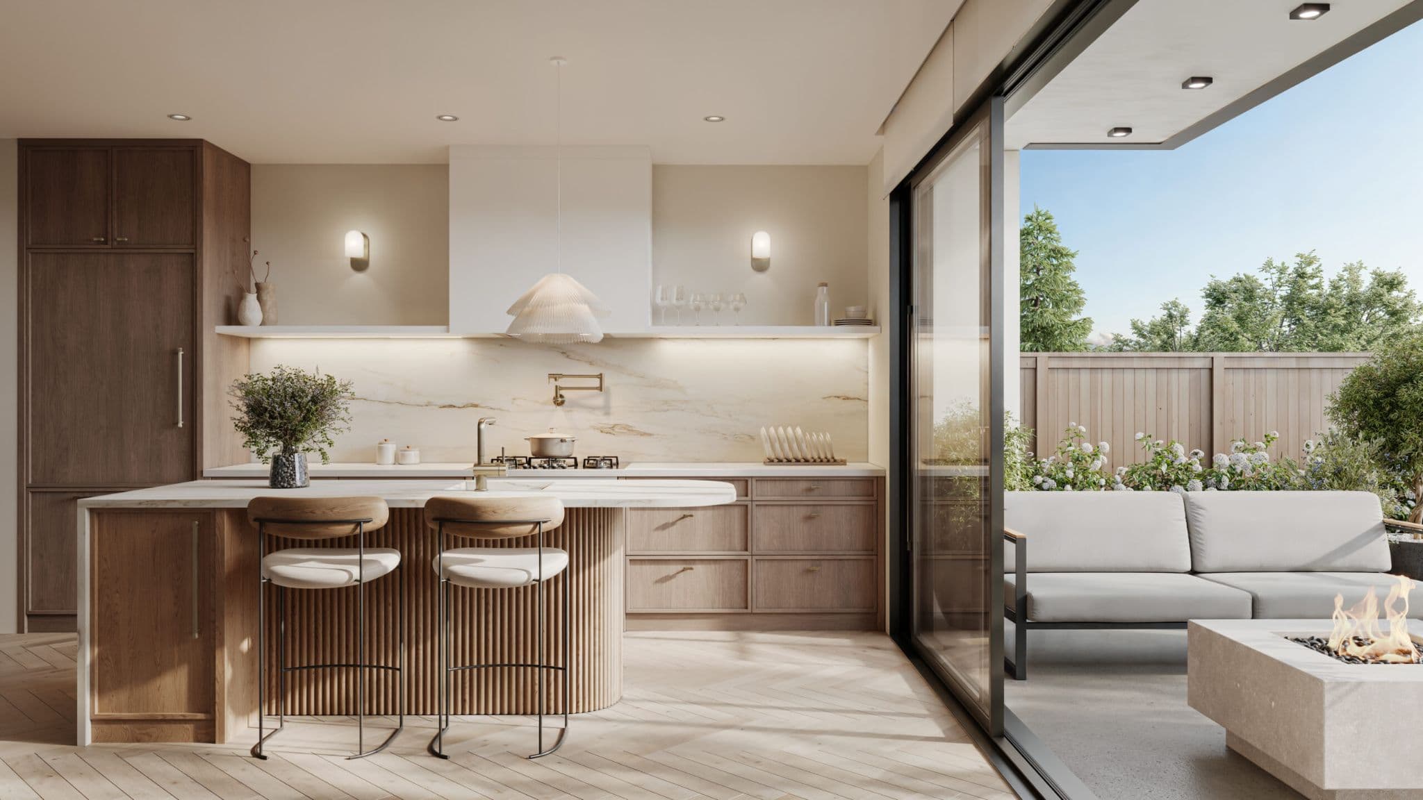 Octave – A modern open-concept kitchen featuring light-toned wood cabinetry, a fluted island with barstools, marble backsplash, and herringbone hardwood floors. Large sliding glass doors open directly to a private outdoor patio with a seating area and a modern fire pit under clear daytime light.