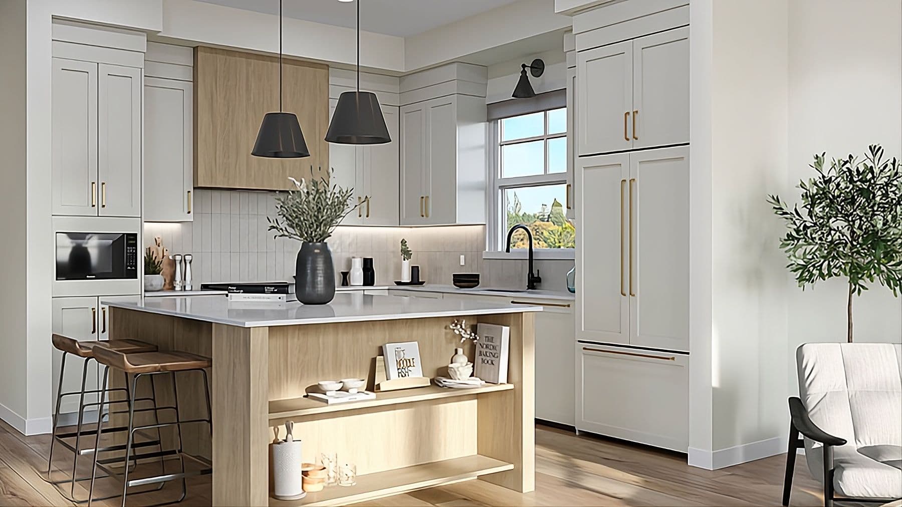 Encore Estates – Kitchen with white cabinetry, wood island, built-in microwave, gold hardware, and a window over the sink looking onto trees.