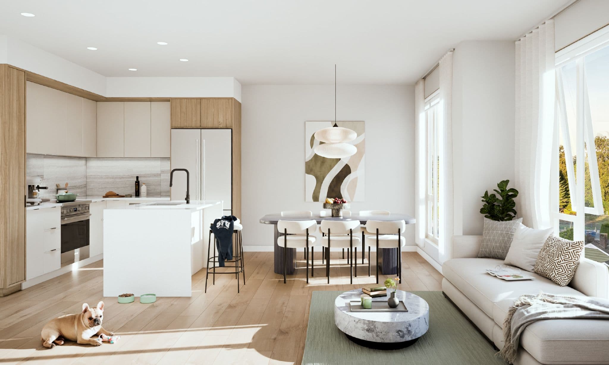 Harriswood – Open-concept kitchen, dining, and living area with light wood cabinetry, a white island, a dining table, and a dog lying on the floor.