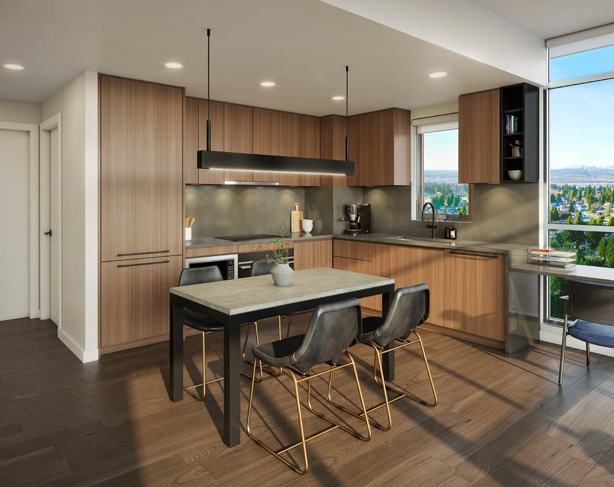Walker House – A modern open-concept kitchen and dining area features warm wood-grain cabinetry, dark grey countertops, and a central dining table with four black leather chairs on brass frames. Sunlight streams through floor-to-ceiling windows on the right, illuminating dark hardwood floors and offering expansive views of distant greenery and water.