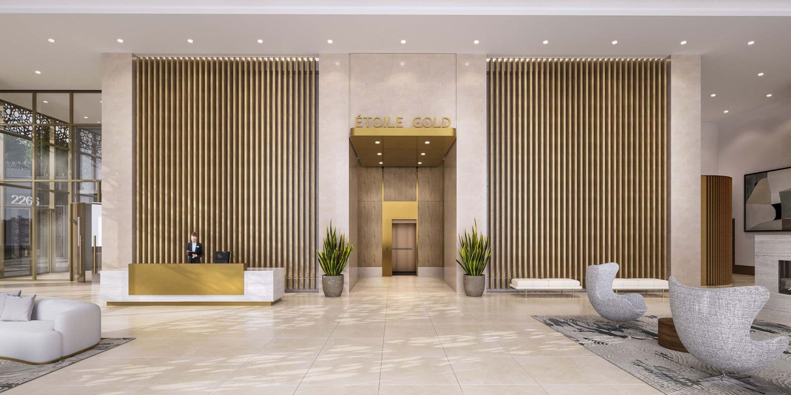 Étoile Gold Brentwood – Building lobby with a concierge desk, gold entry sign reading 'Etoile Gold,' wood slat walls, and seating area.