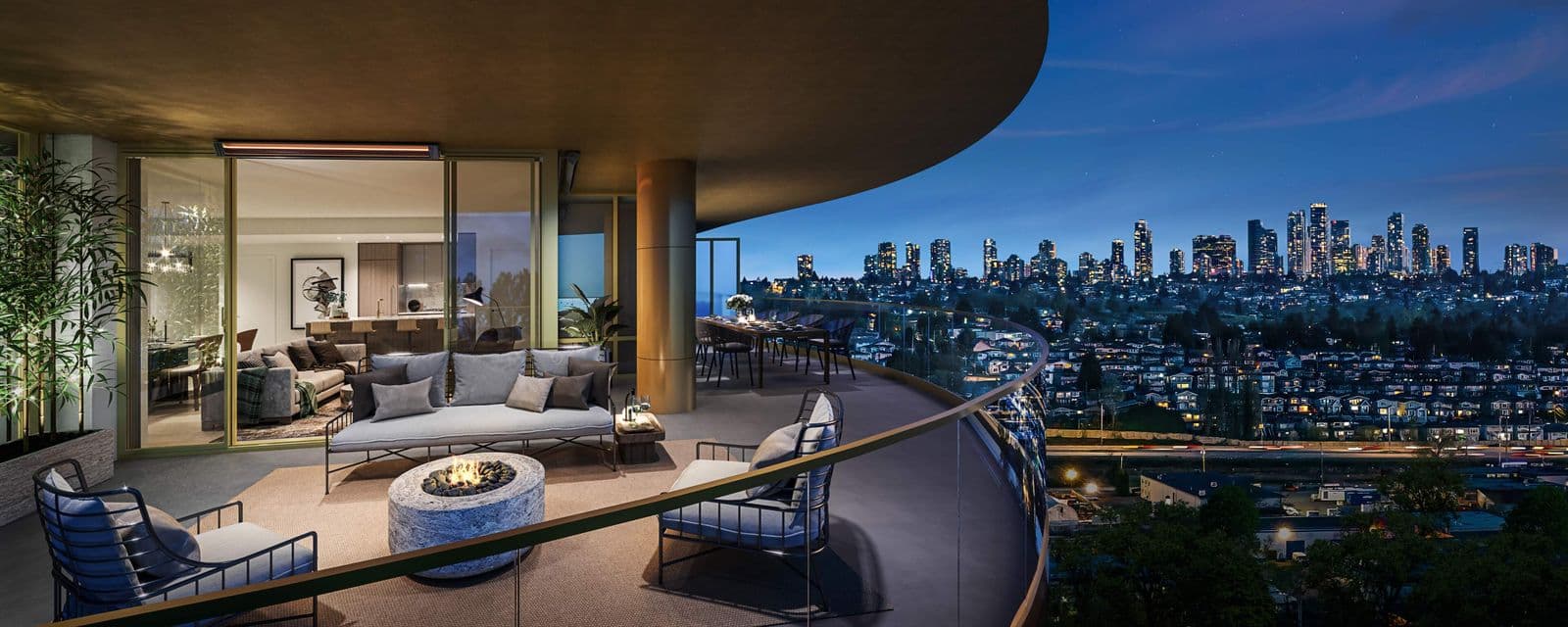 Étoile Gold Brentwood – Private balcony lounge area with sofa and fire pit table looking out over a lit-up city skyline at dusk.