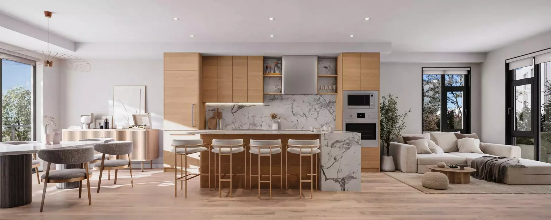 Edge Way at leləm̓ – A bright, open-concept kitchen and living area featuring light wood flooring, floor-to-ceiling windows, and ample natural daylight. The kitchen showcases flat-panel wooden cabinetry, an integrated oven and microwave, and a marble waterfall island with four barstools, framed by an adjacent dining table and comfortable living room seating.