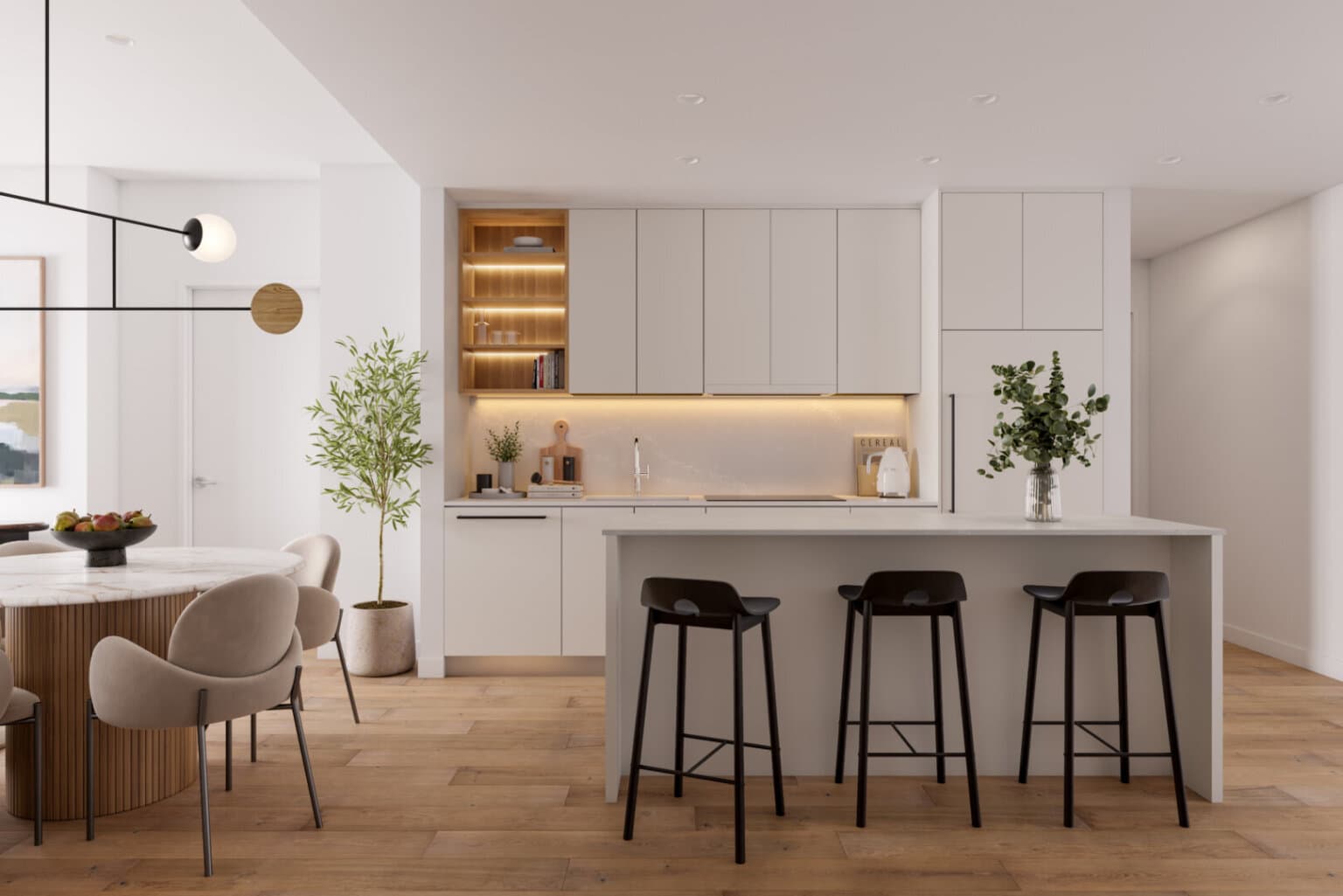 Inlet District – A modern, open-concept kitchen and dining area featuring light wood floors, flat-panel white cabinetry, and warm integrated under-cabinet lighting. An island with a white waterfall countertop is paired with three black barstools, set alongside an adjacent dining table with curved upholstered chairs.