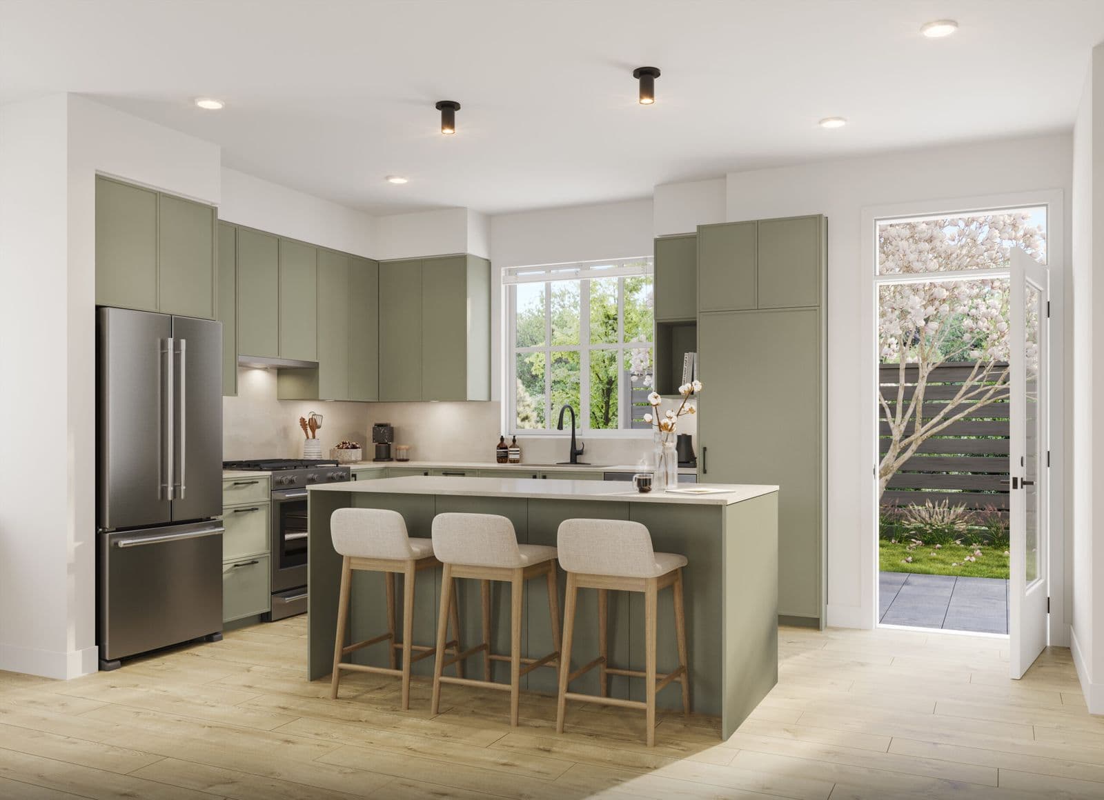 Latimer Walk – Kitchen with the same layout in sage green cabinetry and a French door leading to a blossoming backyard.