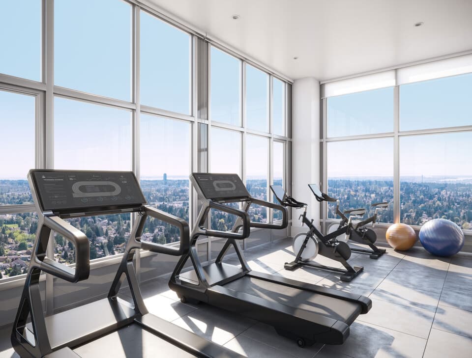 One Central – Rendering of a fitness room with treadmills and stationary bikes facing floor-to-ceiling windows with a panoramic city view.