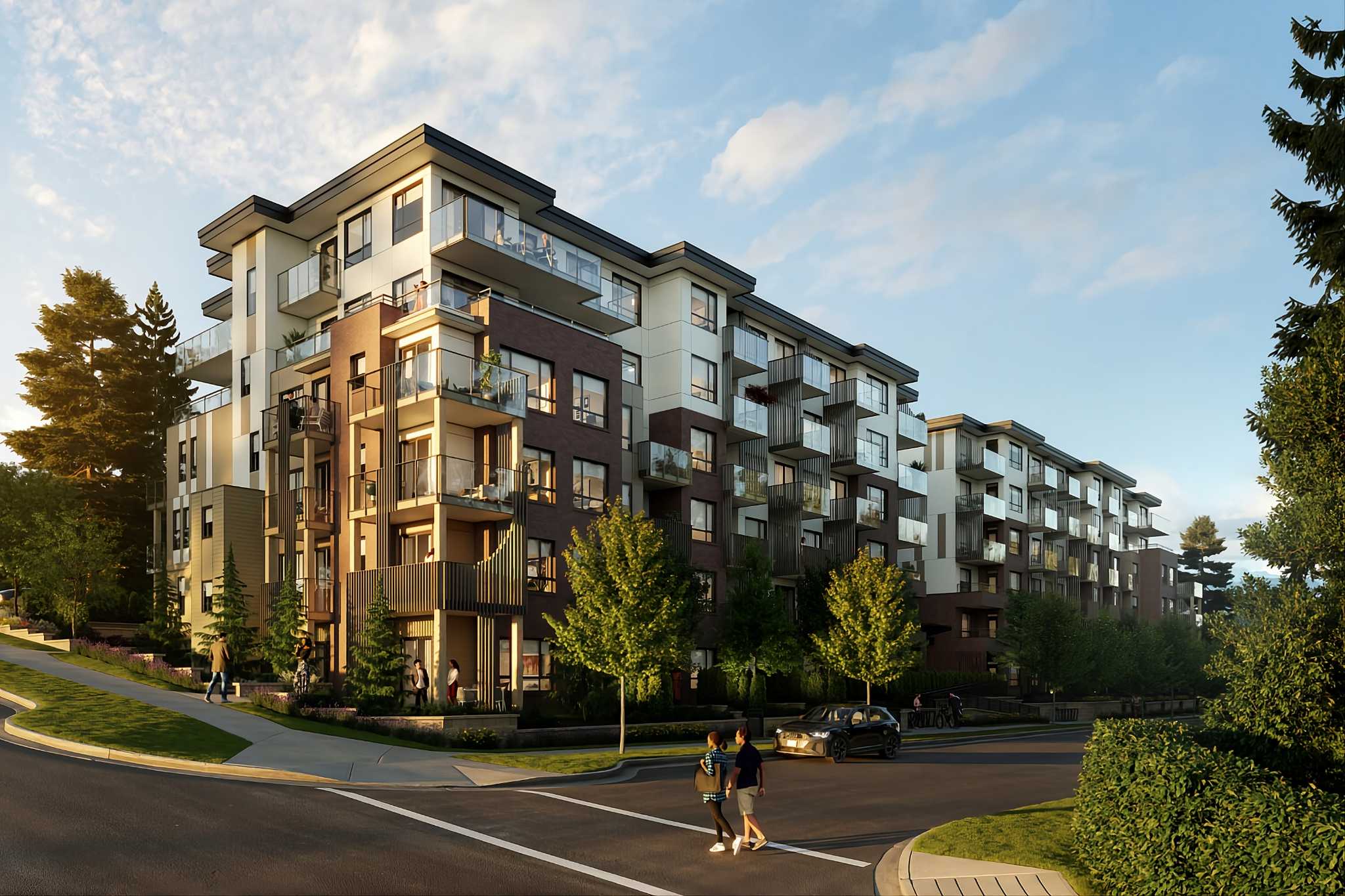 Arcadia Condos – Street corner view of the same condo building at golden hour, with pedestrians crossing and a car parked along the curb.