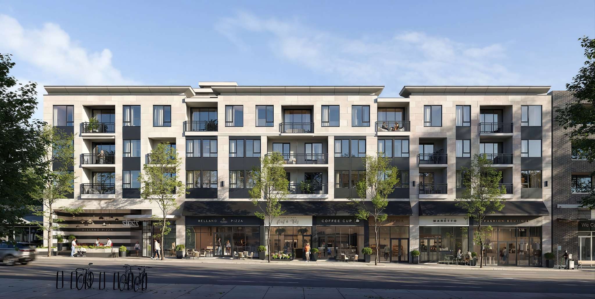 Siena Burnaby – Street-level view of the Siena mixed-use building with beige stone and dark panel facade, balconies, and ground-floor retail including a pizzeria, coffee shop, and fashion boutique.