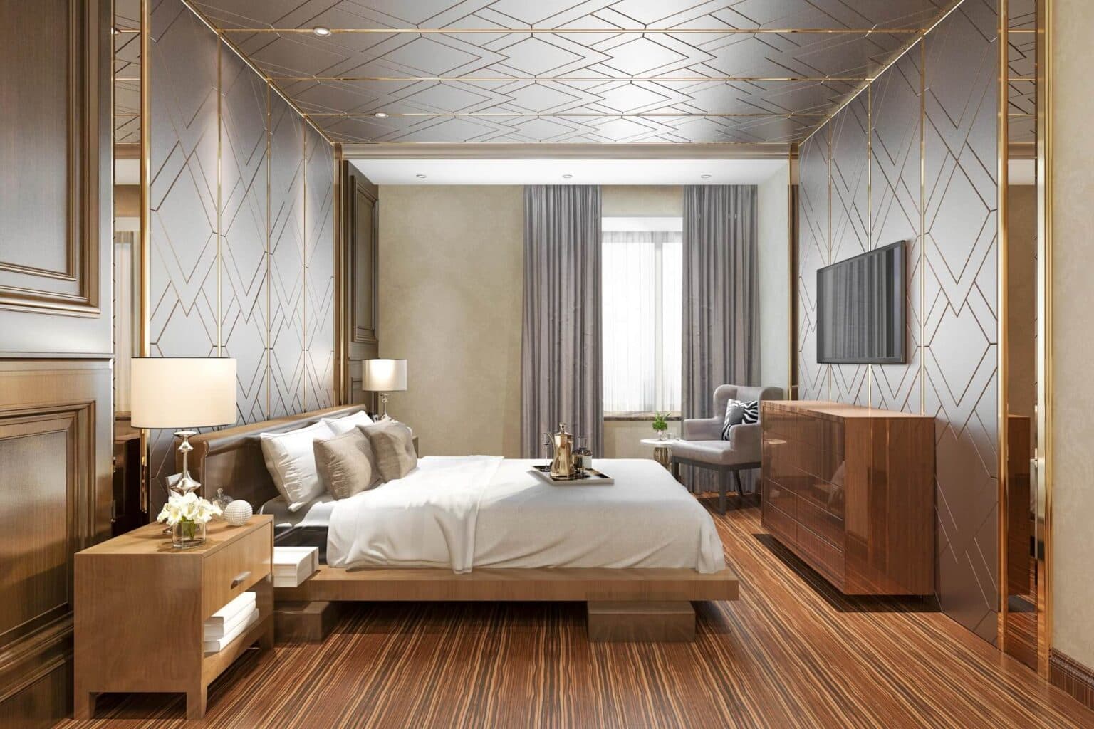 Water Tower Hill – A luxurious, modern bedroom featuring a low wooden platform bed flanked by bedside tables and set against walls and a ceiling with metallic geometric line patterns. Warm-toned linear wood flooring, polished cabinetry, an armchair near a window draped in sheer curtains, and soft accent lighting complete the elegant space.