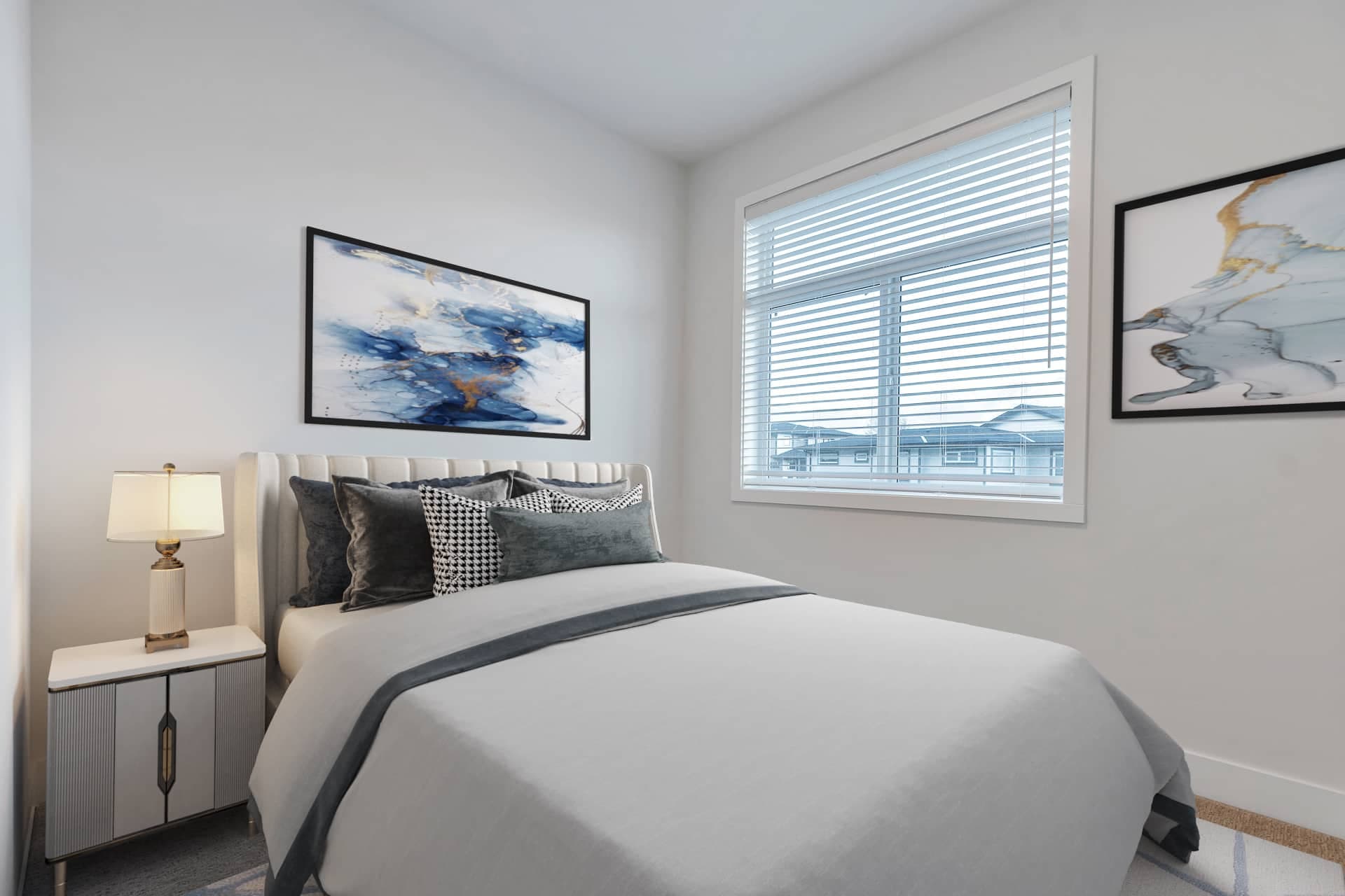 Osprey Ridge – Bedroom with a gray upholstered headboard, patterned throw pillows, and a large blue-toned abstract painting above a nightstand.