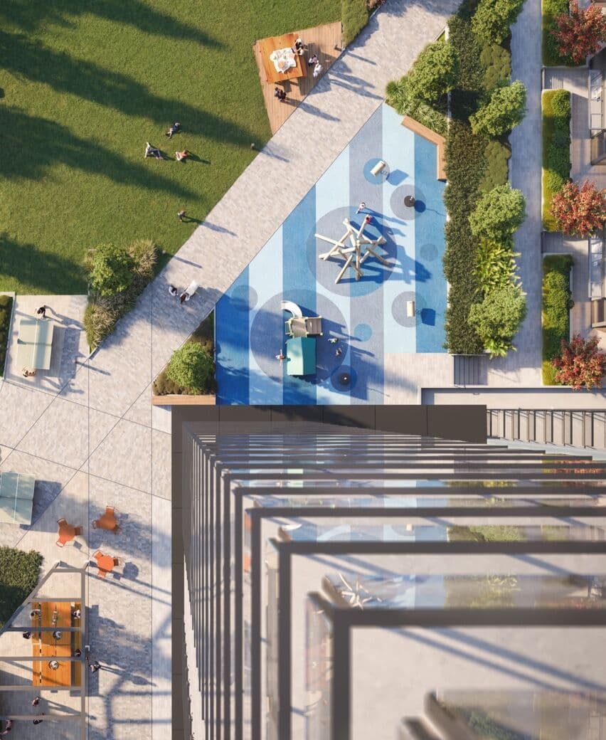 Debut – Overhead drone shot of a rooftop or courtyard amenity deck with a children's play area, seating, lawn, and pathways.